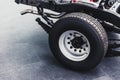 Close up pickup truck rear tire with car chassis underbody Royalty Free Stock Photo