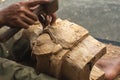 close up of a Balinese woodcarver making wooden Barong mask Royalty Free Stock Photo