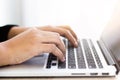 A close-up picture of a business man typing on a laptop keyboard . Royalty Free Stock Photo