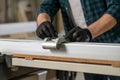 Close up picture of carpenter hewing the wood Royalty Free Stock Photo