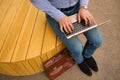 Close-up of typing man. Office worker sitting with a new laptop on the urban background. Progressive technology concept. Royalty Free Stock Photo