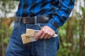 Home handyman: Rear view of a young man with paint brushes in his pocket Royalty Free Stock Photo