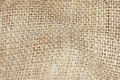 Close up picture of crumpled old burlap background. Ecological, natural fabric packing issue, rustic jute backdrop Royalty Free Stock Photo