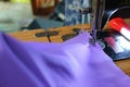 Close up hand, Asian women are catching fine fabrics, purple, sewing, cutting women dresses, sewing with old machines, vintage