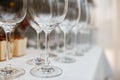 Close up picture of empty glasses on the beige tablecloth