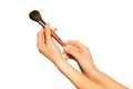 Female hands holding makeup powder brush on white Royalty Free Stock Photo