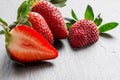 Close up picture of fresh red strawberries lying on a black stone table Royalty Free Stock Photo