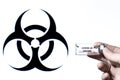Vial filled with liquid on white background with biohazard symbol