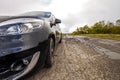 Close-up picture of a modern car on a bad road Royalty Free Stock Photo