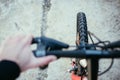 Mountain bike tyres outside, blurry handlebar, summer day, city mobility Royalty Free Stock Photo