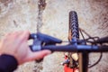 Mountain bike tyres outside, blurry handlebar, summer day, city mobility Royalty Free Stock Photo