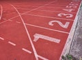 Close up picture Numbers on running tracks in athletic stadium. Royalty Free Stock Photo