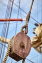 Close up of old sailing ship wooden pulley. Royalty Free Stock Photo