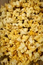 A close-up picture of popcorn placed on a plank. Royalty Free Stock Photo