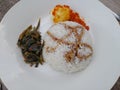 Close-up picture of rice with boiled egg red chili and stir-fried kale and a little soy sauce on a white plate Royalty Free Stock Photo