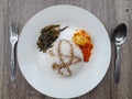 Close-up picture of rice with boiled egg red chili and stir-fried kale and a little soy sauce on a white plate Royalty Free Stock Photo