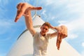 Close-up of a cool teenage guy. A handsome man near the electric windmill. A confident male on a blue sky background. Royalty Free Stock Photo