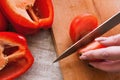 Close up picture of tomatoes and pepper cutting