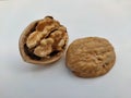 Close up picture of the walnut with it`s  shells on white background. Royalty Free Stock Photo