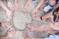 Close-up picture of women`s hands on the sand. making the form of heart. Hen party celebration on the beach Royalty Free Stock Photo