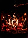 Close up picture of wood burning in a camp fire. Hot Red Flames. Taken in Nova Scotia, Canada Dark Mood Royalty Free Stock Photo