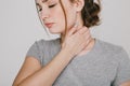 Close up picture of young woman with neckache .