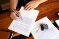 Close-up pictures of the hands of businessmen signing and stamping in approved contract forms Royalty Free Stock Photo