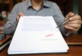 Close-up pictures of the hands of businessmen signing and stamping in approved contract forms Royalty Free Stock Photo