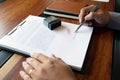 Close-up pictures of the hands of businessmen signing and stamping in approved contract forms