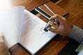 Close-up pictures of the hands of businessmen signing and stamping in approved contract forms