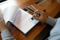 Close-up pictures of the hands of businessmen signing and stamping in approved contract forms