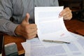 Close-up pictures of the hands of businessmen signing and stamping in approved contract forms Royalty Free Stock Photo