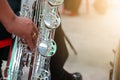 Close-up pictures of musicians playing Baritone Saxophone In the music practice room, blurred background