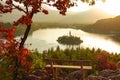 CLOSE UP: Picturesque shot of an empty wooden bench and the famous lake Bled. Royalty Free Stock Photo