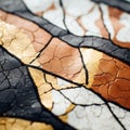 a close up of a piece of broken glass with gold and black paint on it Royalty Free Stock Photo