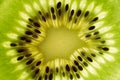 Close-up of a piece of fresh ripe kiwi green. Kiwi or Chinese gooseberry close-up. Fresh juicy slice of fruit with seeds Royalty Free Stock Photo