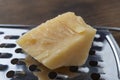 Close-up of a piece of parmesan. Hard cheese,