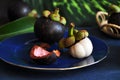 Piece of Small Mangosteen on Blue Plate