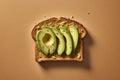 Close-up of a piece of toast bread with slices of avocado and seasonings