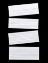 Close up piece of white lined paper isolated on black Royalty Free Stock Photo