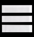 Close up piece of white lined paper isolated on black Royalty Free Stock Photo