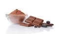 Close-up pieces of chocolate bar with cocoa beans and bowl of cocoa powder Royalty Free Stock Photo