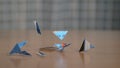 CLOSE UP: Pieces of a shredded credit card scatter across the wooden table. Royalty Free Stock Photo