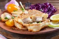 close-up pieces of tilapia fish in cheese batter lightly fried in olive oil. appetizing healthy food Royalty Free Stock Photo