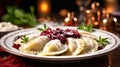 Close-up of Pierogi. Beautifully garnished Polish Christmas Eve dish. Pierogi are neatly arranged on vintage ceramic