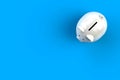 Close up of piggy bank isolated on blue background, Top view with copy space, Finance concept Royalty Free Stock Photo