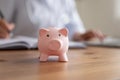 Close up of piggybank on table for donation