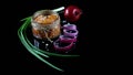 Close up pike caviar in jar, Delicious caviar, roe purple onion cut into rings Isolated on a black background, Flat lay. Copy spac