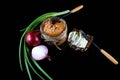 Close-up Pike caviar, roe in a glass jar, raw farm eggs, purple onion, green onions, black grain bread with butter, Isolated on a