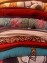 Close up of a pile of assorted ironed and folded clothes